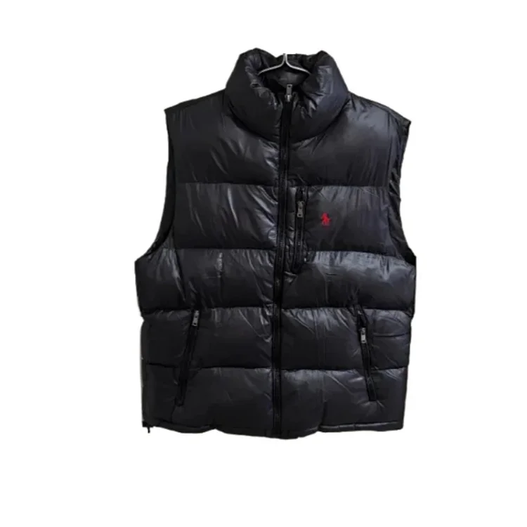 black vest with a red label